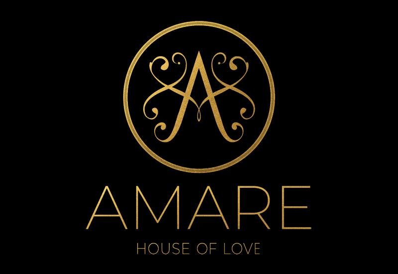 לוגו של AMARE אמארה רקע שחור כיתוב זהב סלוגן house of love